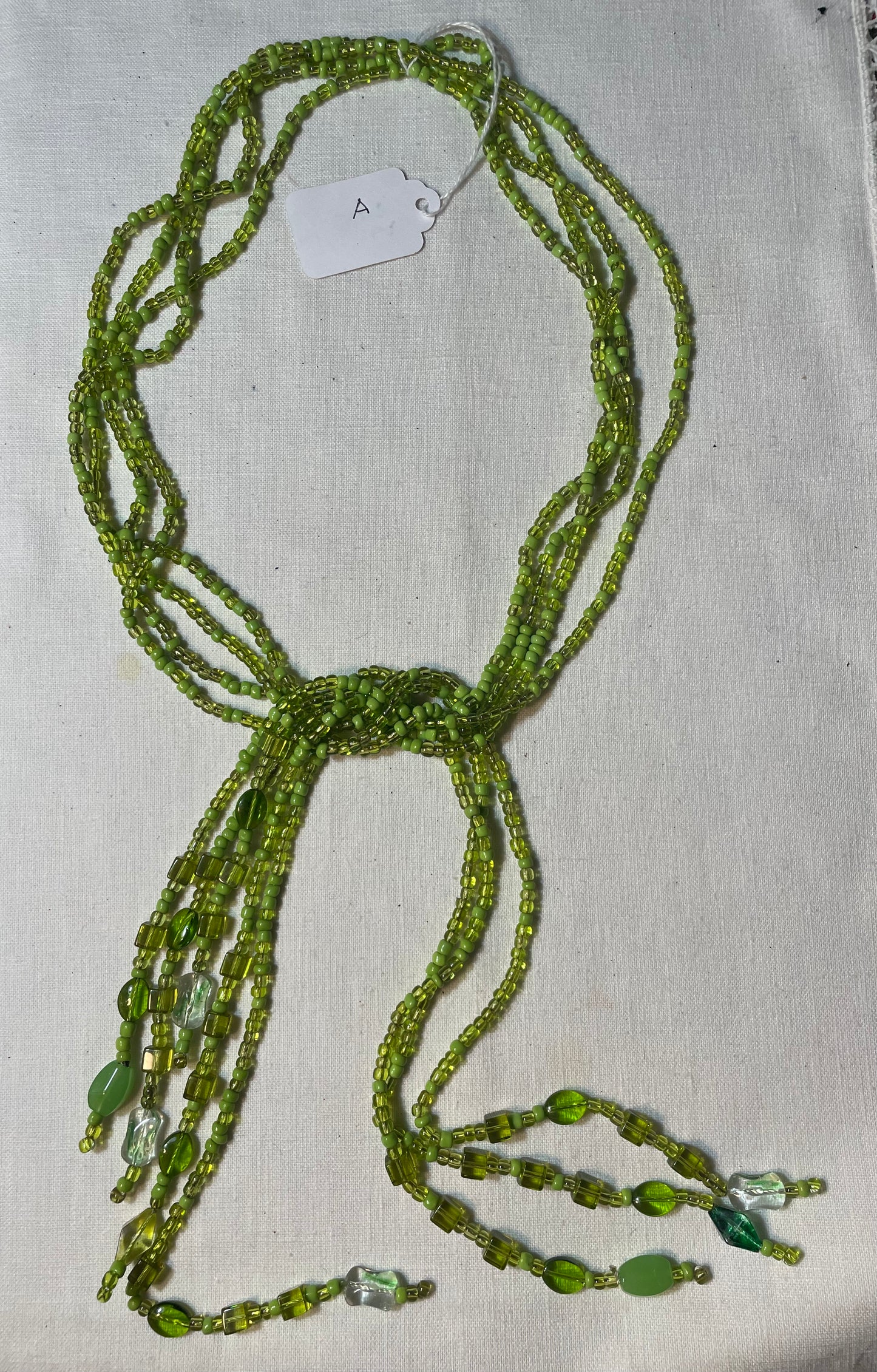 A beautiful vintage multistrand green bead boho necklace