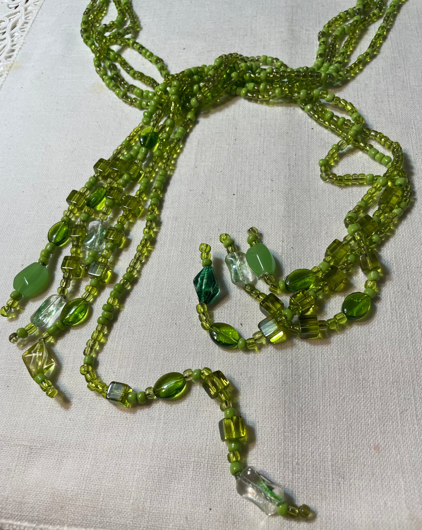 A beautiful vintage multistrand green bead boho necklace