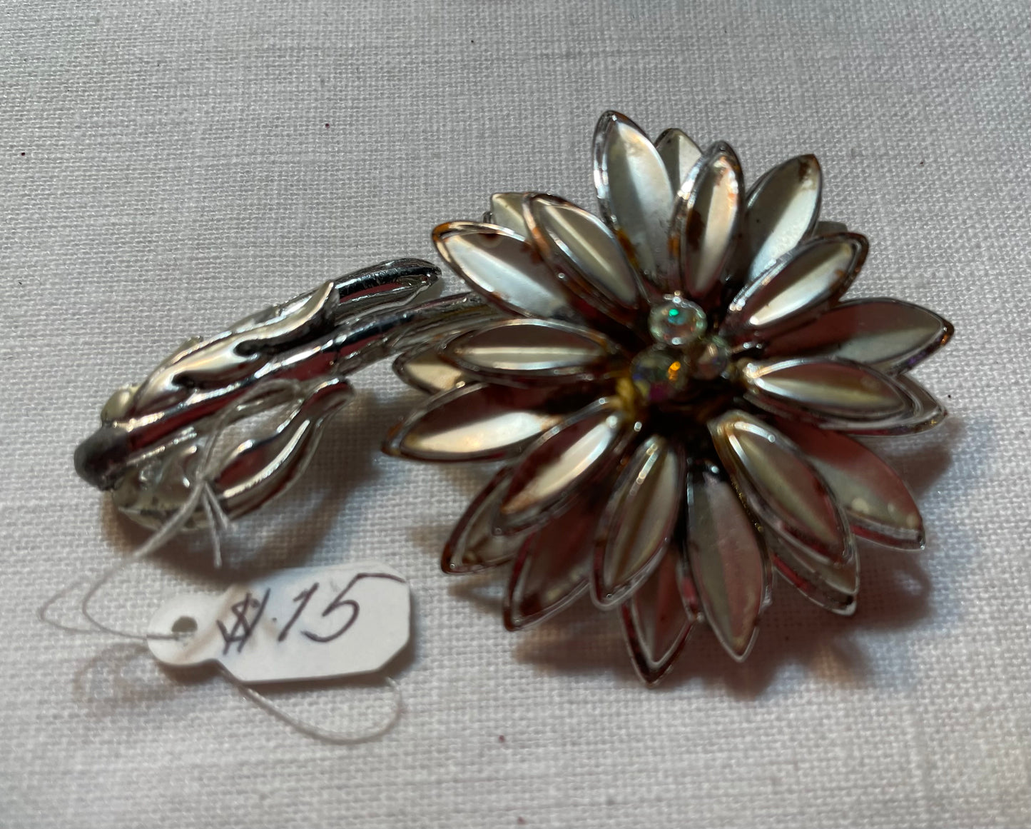 Gorgeous vintage flower pin with iridescent rhinestones