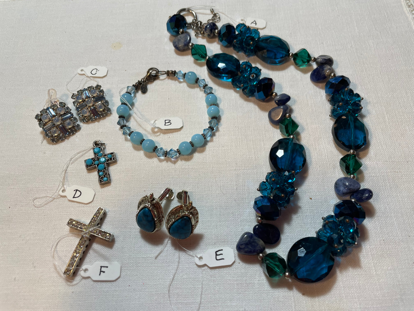 A lot of sparkly blue vintage jewelry