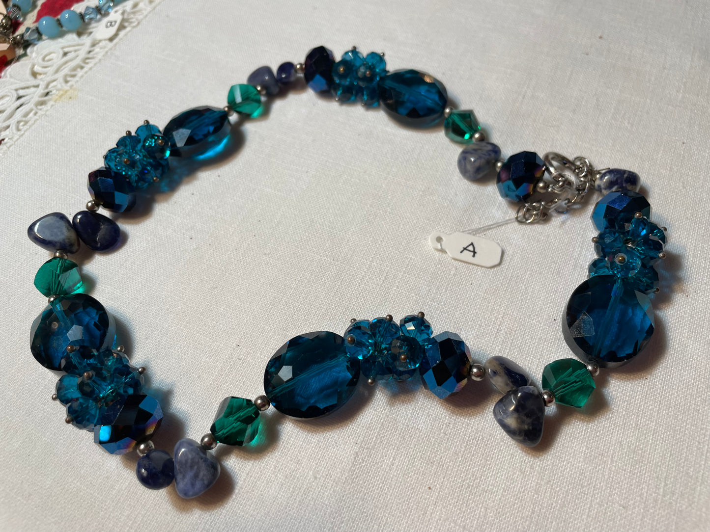 A lot of sparkly blue vintage jewelry