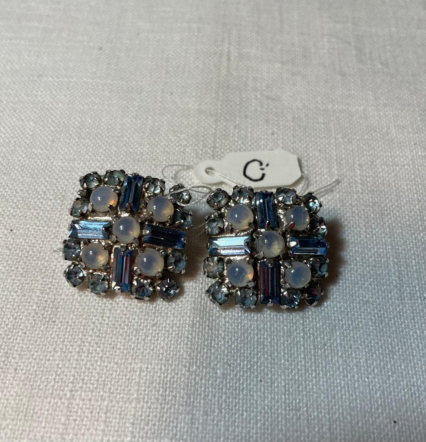 A lot of sparkly blue vintage jewelry