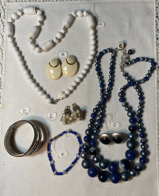 A lot of vintage white, gold and blue jewelry